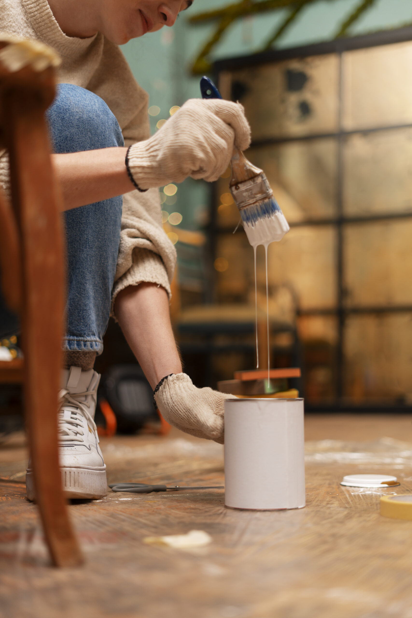 side view woman restoring wooden furniture
